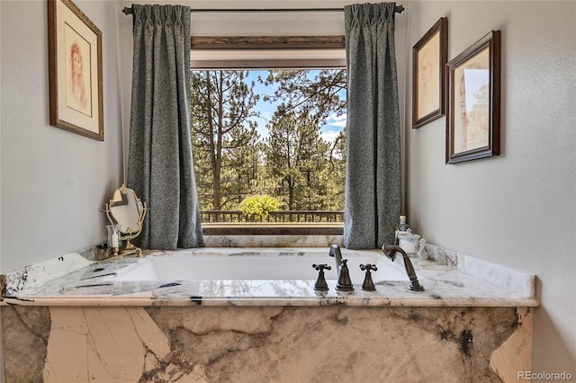 bathroom with a tub to relax in