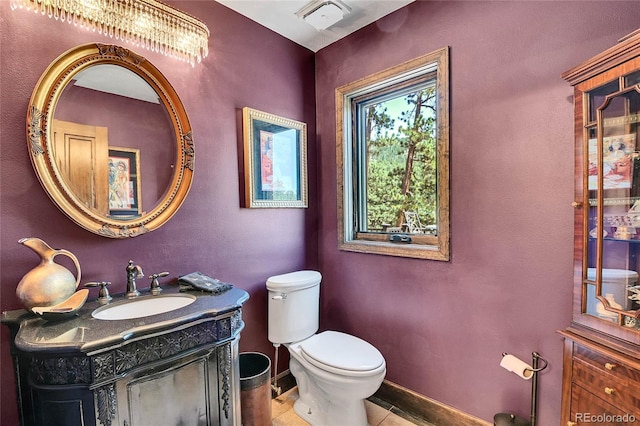 bathroom featuring vanity and toilet