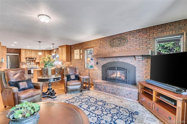 living room with brick wall and a brick fireplace