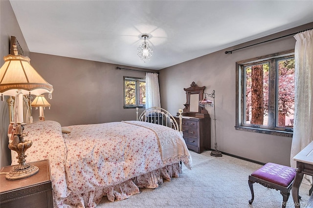 bedroom featuring light carpet