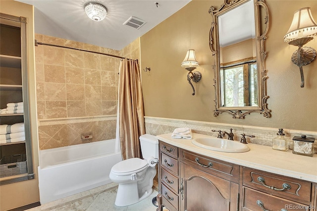 full bathroom featuring shower / bathtub combination with curtain, vanity, toilet, and tile patterned flooring