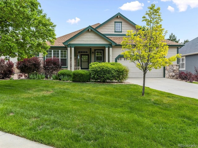 1836 S Kendall Ct, Lakewood, CO 80232 - craftsman house featuring concrete driveway, a front yard, roof with shingles, and stone siding