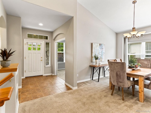 1836 S Kendall Ct, Lakewood, CO 80232 - entryway with a chandelier, carpet, baseboards, vaulted ceiling, and tile patterned floors