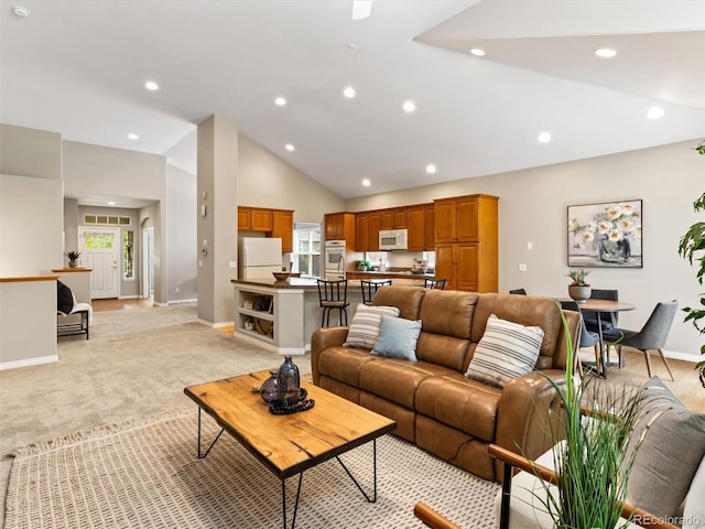 1836 S Kendall Ct, Lakewood, CO 80232 - living area with lofted ceiling, baseboards, recessed lighting, and light colored carpet