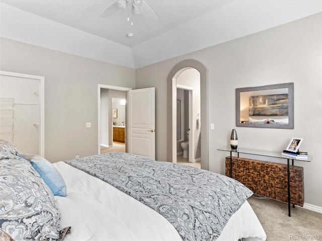 1836 S Kendall Ct, Lakewood, CO 80232 - bedroom with arched walkways, light carpet, ensuite bath, a ceiling fan, and baseboards