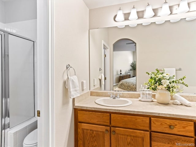 1836 S Kendall Ct, Lakewood, CO 80232 - ensuite bathroom with vanity, a stall shower, and toilet
