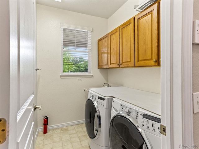 1836 S Kendall Ct, Lakewood, CO 80232 - laundry room featuring cabinet space, washing machine and clothes dryer, and baseboards