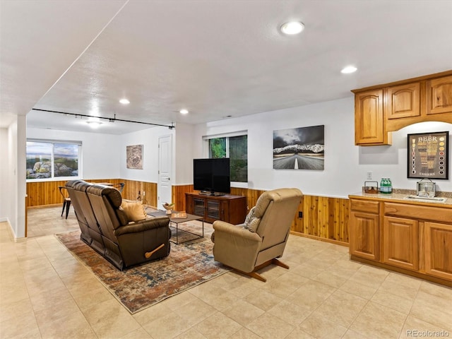 1836 S Kendall Ct, Lakewood, CO 80232 - living room with a wainscoted wall, wood walls, and recessed lighting