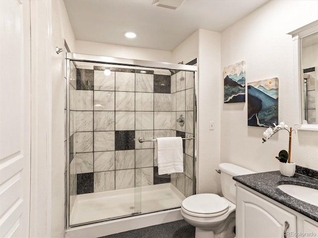 1836 S Kendall Ct, Lakewood, CO 80232 - full bathroom featuring vanity, a stall shower, toilet, and recessed lighting