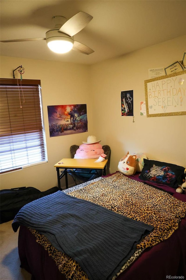 carpeted bedroom featuring a ceiling fan