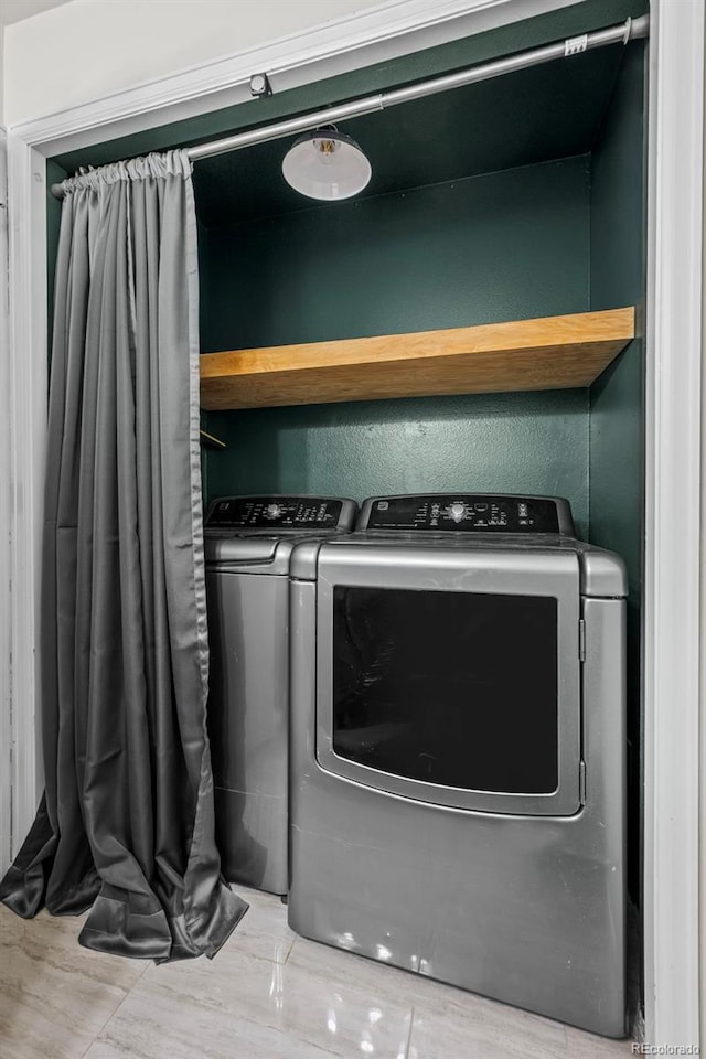 laundry room featuring washing machine and dryer