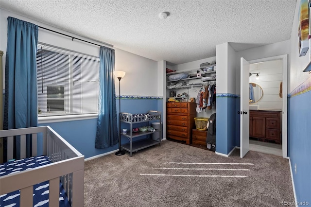 carpeted bedroom with a textured ceiling