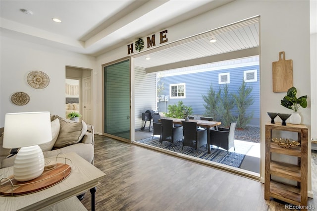 living area with wood finished floors and recessed lighting