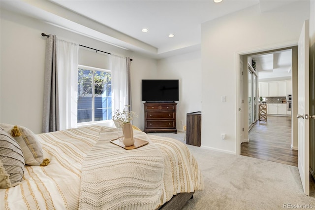 carpeted bedroom featuring recessed lighting and baseboards