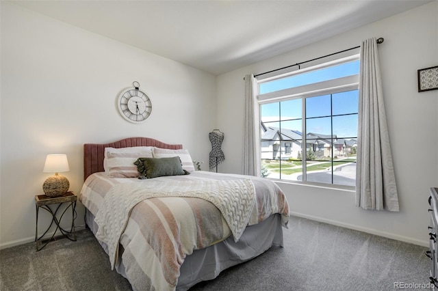 carpeted bedroom with baseboards