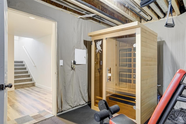 sauna / steam room with wood finished floors