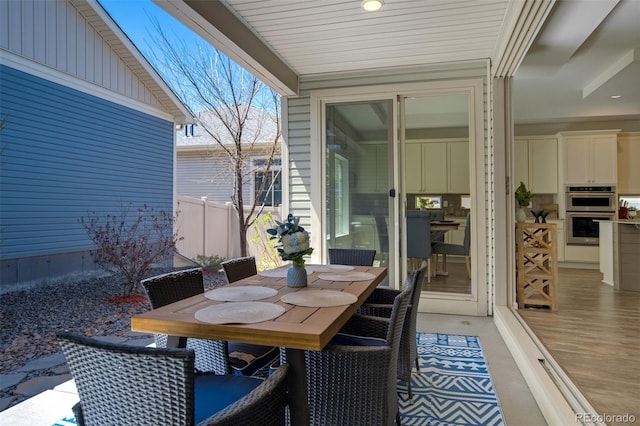 view of patio / terrace with outdoor dining space and fence