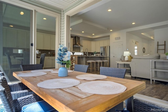 dining area featuring wood finished floors and recessed lighting