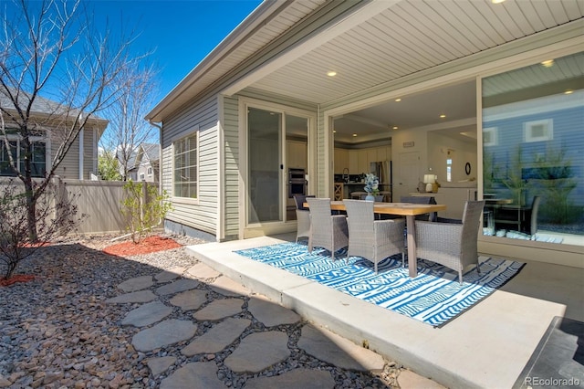view of patio / terrace with outdoor dining space and fence