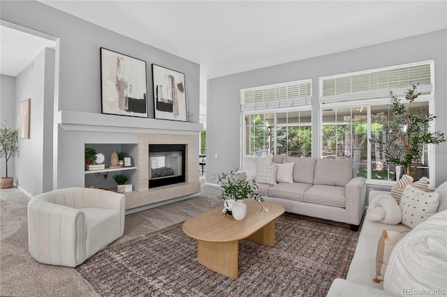 8651 Mallard Pl, Highlands Ranch, CO 80126 - living room with carpet flooring, a tile fireplace, and built in features