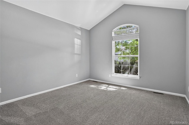 8651 Mallard Pl, Highlands Ranch, CO 80126 - carpeted empty room with vaulted ceiling and baseboards