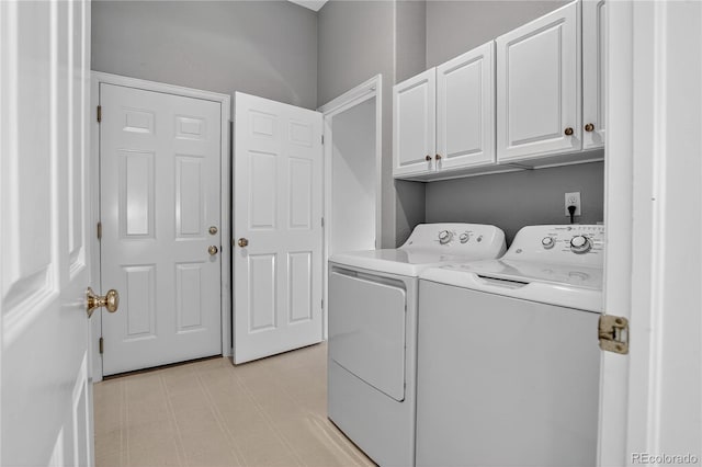 8651 Mallard Pl, Highlands Ranch, CO 80126 - laundry area with separate washer and dryer, cabinet space, and light floors