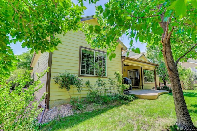 8651 Mallard Pl, Highlands Ranch, CO 80126 - rear view of house featuring a lawn and a patio area