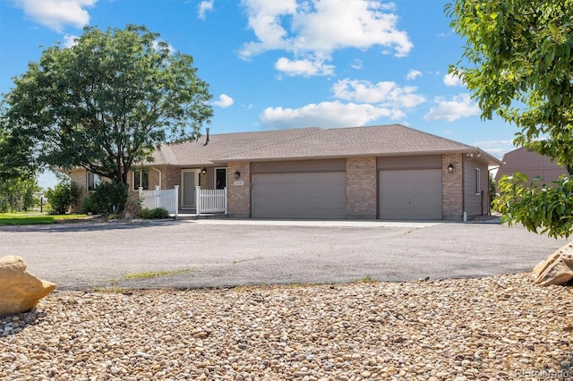 single story home featuring a garage