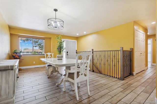 dining area with an inviting chandelier