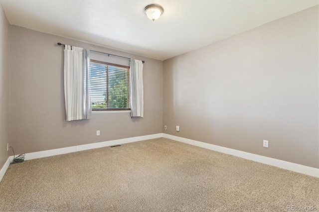 view of carpeted spare room