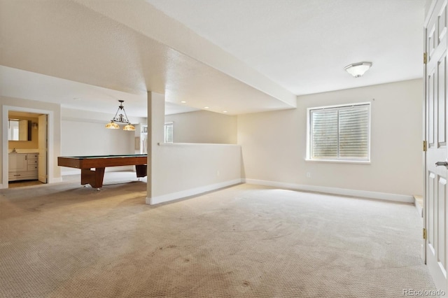 interior space with light colored carpet and pool table