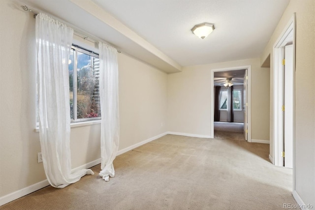 spare room with light colored carpet