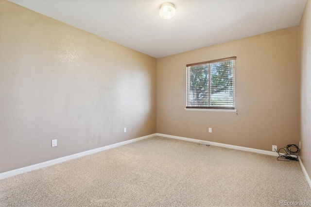 spare room with carpet flooring