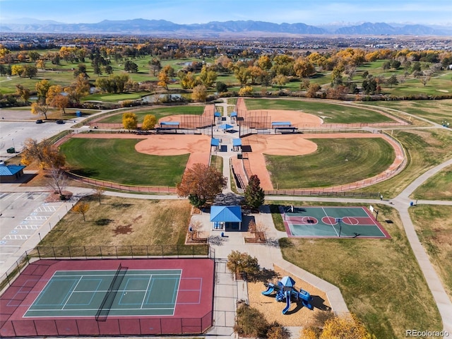 aerial view featuring golf course view and a mountain view
