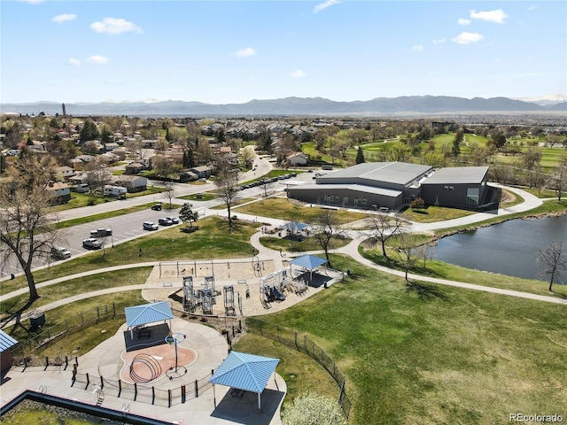 drone / aerial view featuring a water and mountain view