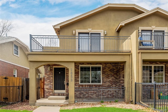 1653 S Logan St, Denver, CO 80210 - multi unit property featuring a balcony, brick siding, and stucco siding
