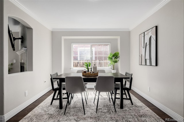 1653 S Logan St, Denver, CO 80210 - dining room featuring ornamental molding and dark wood-style floors