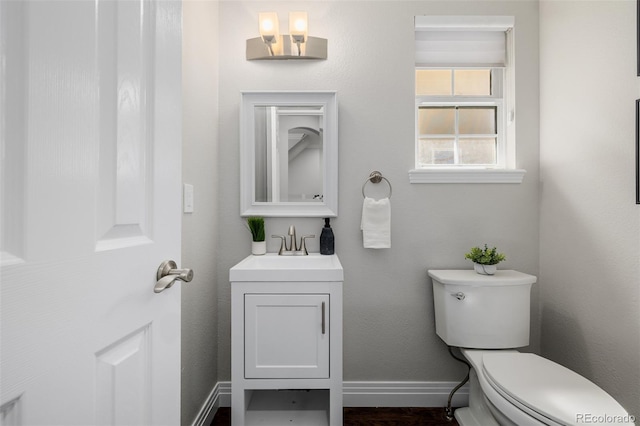 1653 S Logan St, Denver, CO 80210 - bathroom featuring vanity and wood finished floors