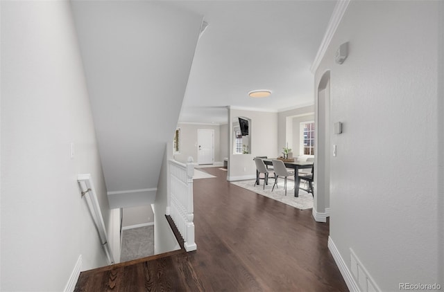 1653 S Logan St, Denver, CO 80210 - hall with crown molding, dark wood-style floors, and an upstairs landing