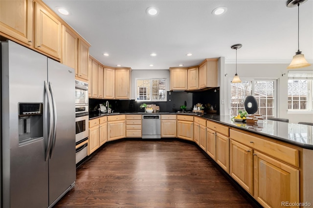 1653 S Logan St, Denver, CO 80210 - kitchen with stainless steel appliances, light brown cabinets, recessed lighting, dark wood-style floors, and a peninsula