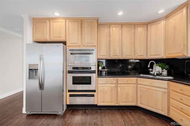 1653 S Logan St, Denver, CO 80210 - kitchen with stainless steel appliances, light brown cabinets, ornamental molding, and recessed lighting