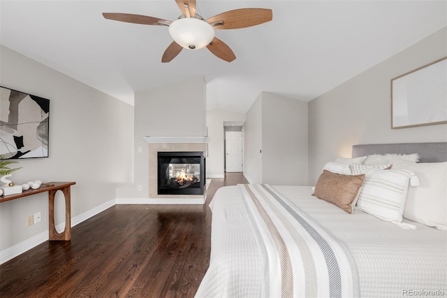 1653 S Logan St, Denver, CO 80210 - bedroom featuring wood finished floors, lofted ceiling, a multi sided fireplace, and ceiling fan