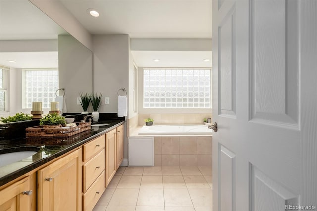 1653 S Logan St, Denver, CO 80210 - full bathroom featuring a bath, double vanity, and tile patterned flooring