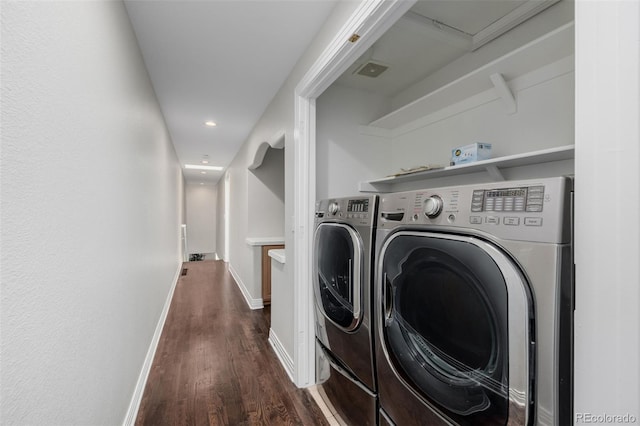 1653 S Logan St, Denver, CO 80210 - laundry room with dark wood finished floors, washing machine and dryer, and recessed lighting