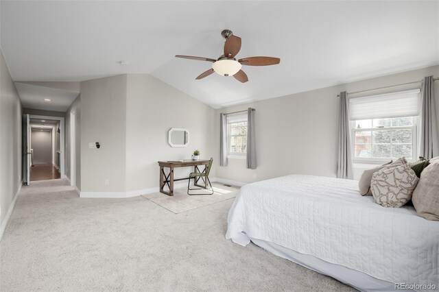 1653 S Logan St, Denver, CO 80210 - bedroom with multiple windows, vaulted ceiling, light carpet, and a ceiling fan