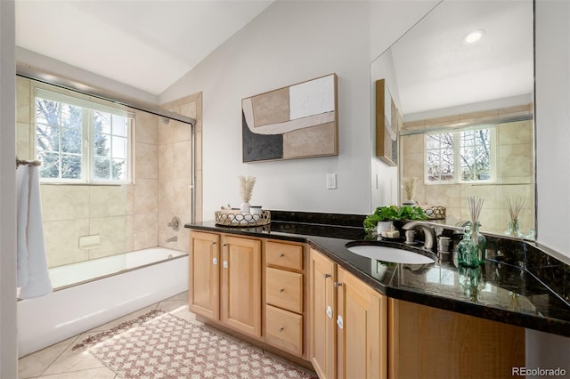 1653 S Logan St, Denver, CO 80210 - full bathroom with lofted ceiling, vanity, washtub / shower combination, and tile patterned flooring
