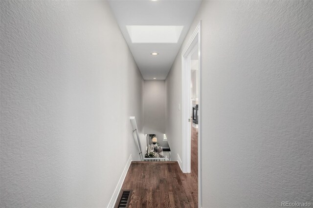 1653 S Logan St, Denver, CO 80210 - hallway featuring an upstairs landing, wood finished floors, a skylight, recessed lighting, and a textured wall