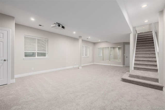 1653 S Logan St, Denver, CO 80210 - unfurnished living room featuring carpet flooring, stairs, and recessed lighting
