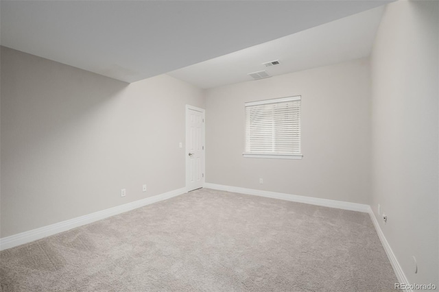 1653 S Logan St, Denver, CO 80210 - spare room with light carpet and baseboards