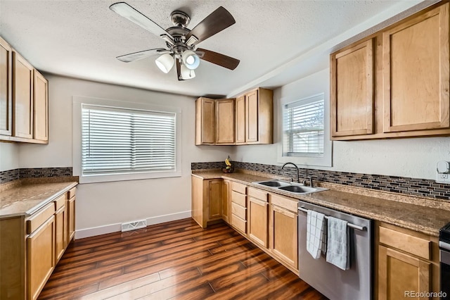 kitchen featuring sink, a wealth of natural light, dishwasher, and dark hardwood / wood-style flooring